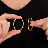 Oval Sectioned Diamond Cut and Satin Finish Hoops in 14K Gold