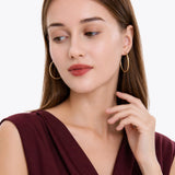 Oval Sectioned Diamond Cut and Satin Finish Hoops in 14K Gold