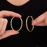 Oval Sectioned Diamond Cut and Satin Finish Hoops in 14K Gold