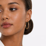 Oval Sectioned Diamond Cut and Satin Finish Hoops in 14K Gold