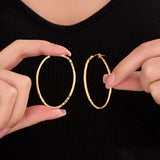 Oval Sectioned Diamond Cut and Satin Finish Hoops in 14K Gold