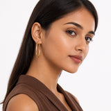 Oval Sectioned Diamond Cut and Satin Finish Hoops in 14K Gold