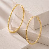 Oval Sectioned Diamond Cut and Satin Finish Hoops in 14K Gold
